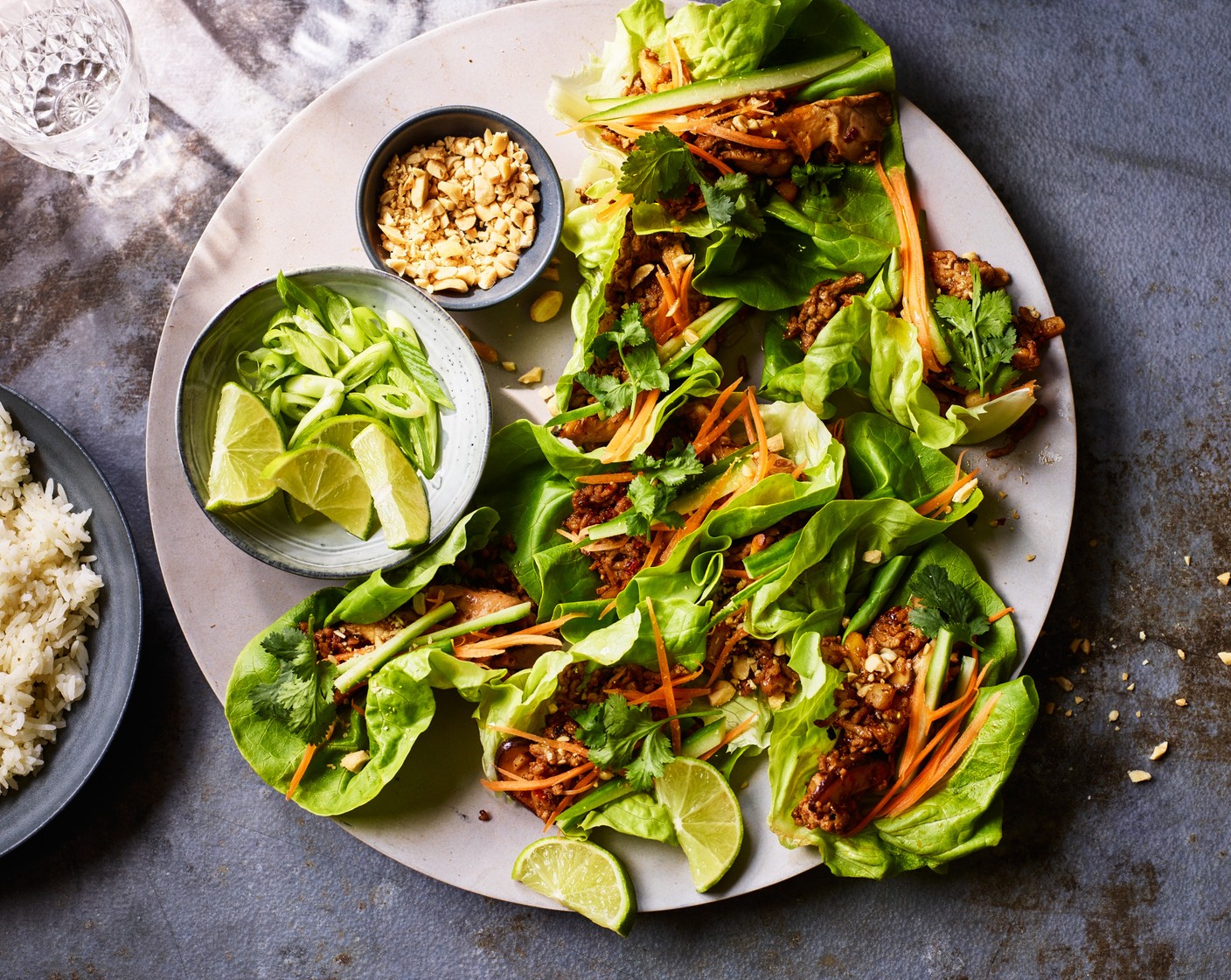 step 5 Top with M&S Remarksable Value carrot (1), cucumber (1/4), M&S spring onions (2), coriander (1 handful) and peanuts (2 tbsp) and serve with wedges of lime (1) and M&S Taste of Asia sticky Jasmine rice (2 packs), heated as per the pack instructions, if you like.