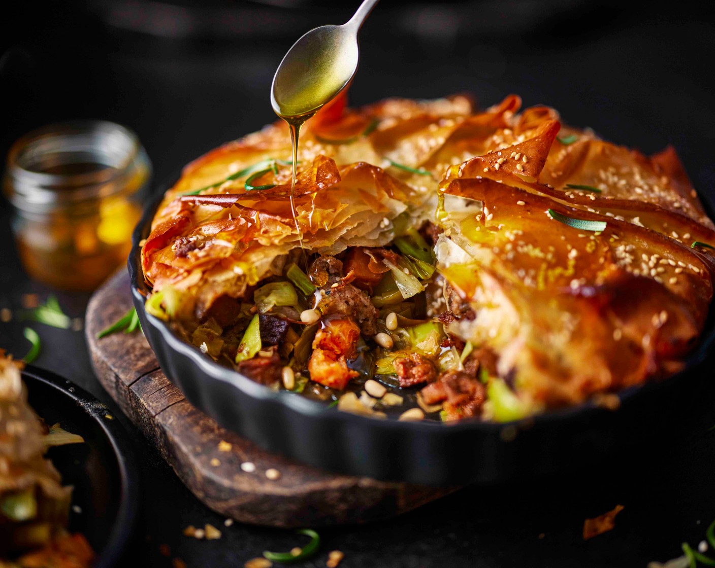 step 6 Place in the bottom of the oven and bake for 40 minutes, until golden. While still warm, drizzle with the honey (1 tbsp) and serve.