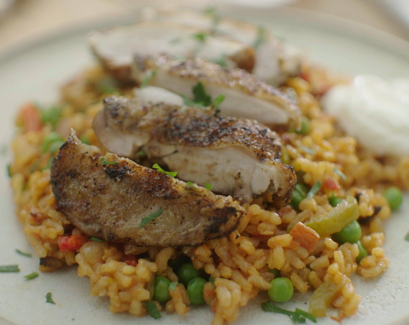 step 6 When you are ready to serve, spoon the rice into bowls and slice the chicken and serve it on top. Sprinkle with parsley (as needed) and serve the aioli (to taste) on the side.
