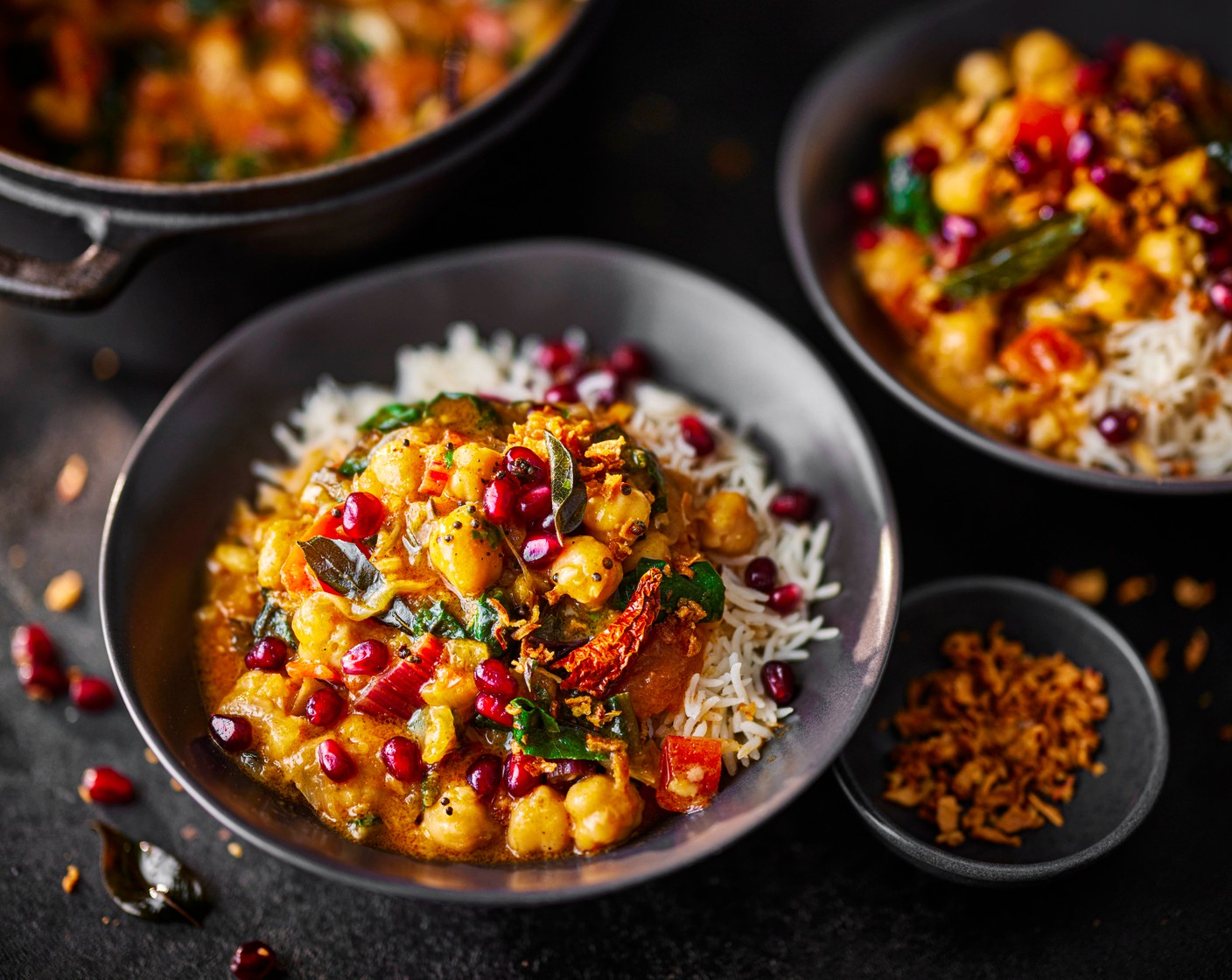 step 6 When the curry is almost ready, heat a splash of oil in a separate small frying pan and add the whole spices. When they sizzle and pop, pour over the curry and serve straight away with the rice. Scatter with the pomegranate seeds (2 tbsp) and crispy onions (1 tbsp).