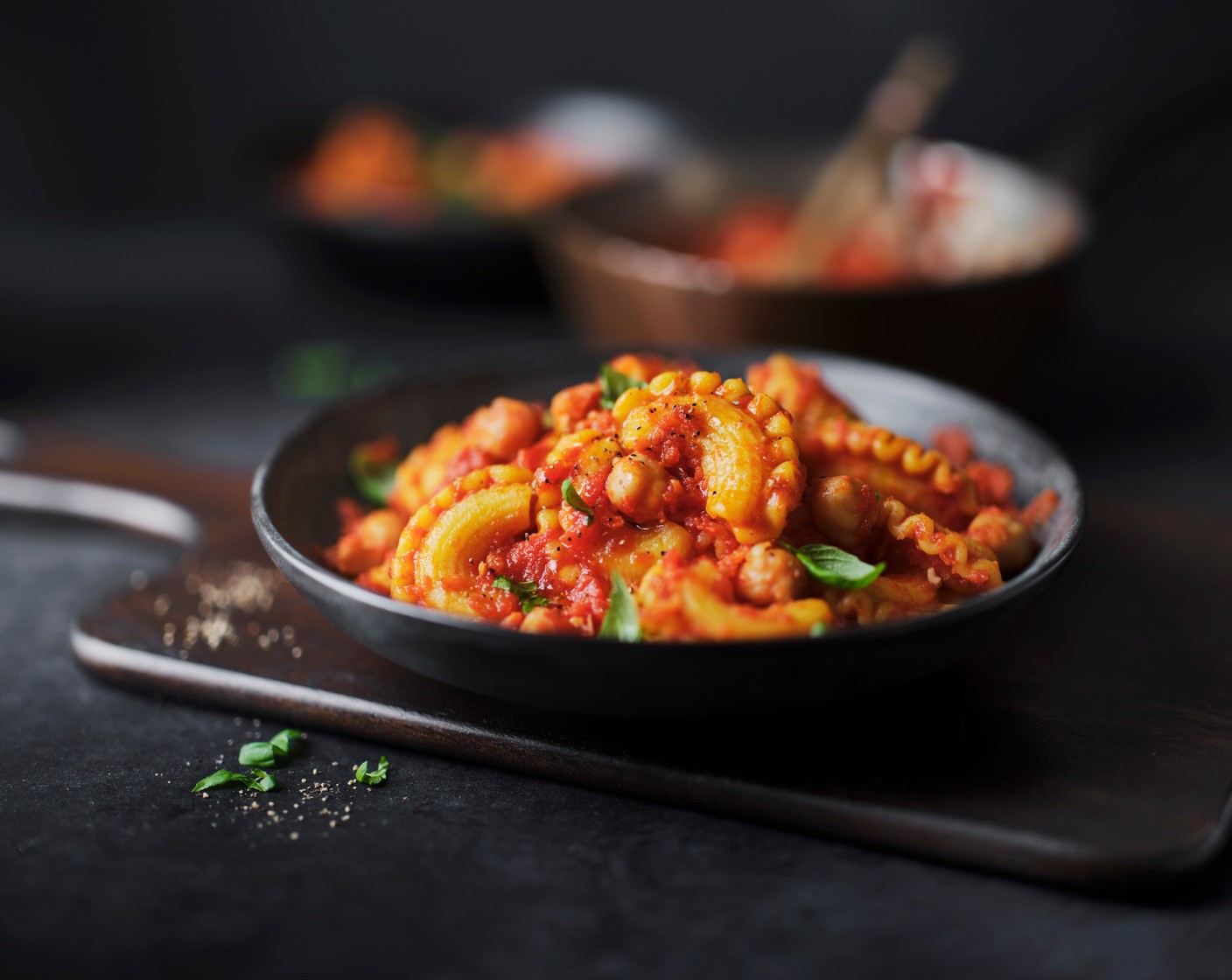 step 4 Drain the pasta with a slotted spoon and toss in the sauce, then spoon into bowls and serve straight away with a scattering of fresh basil (10 g) on top.