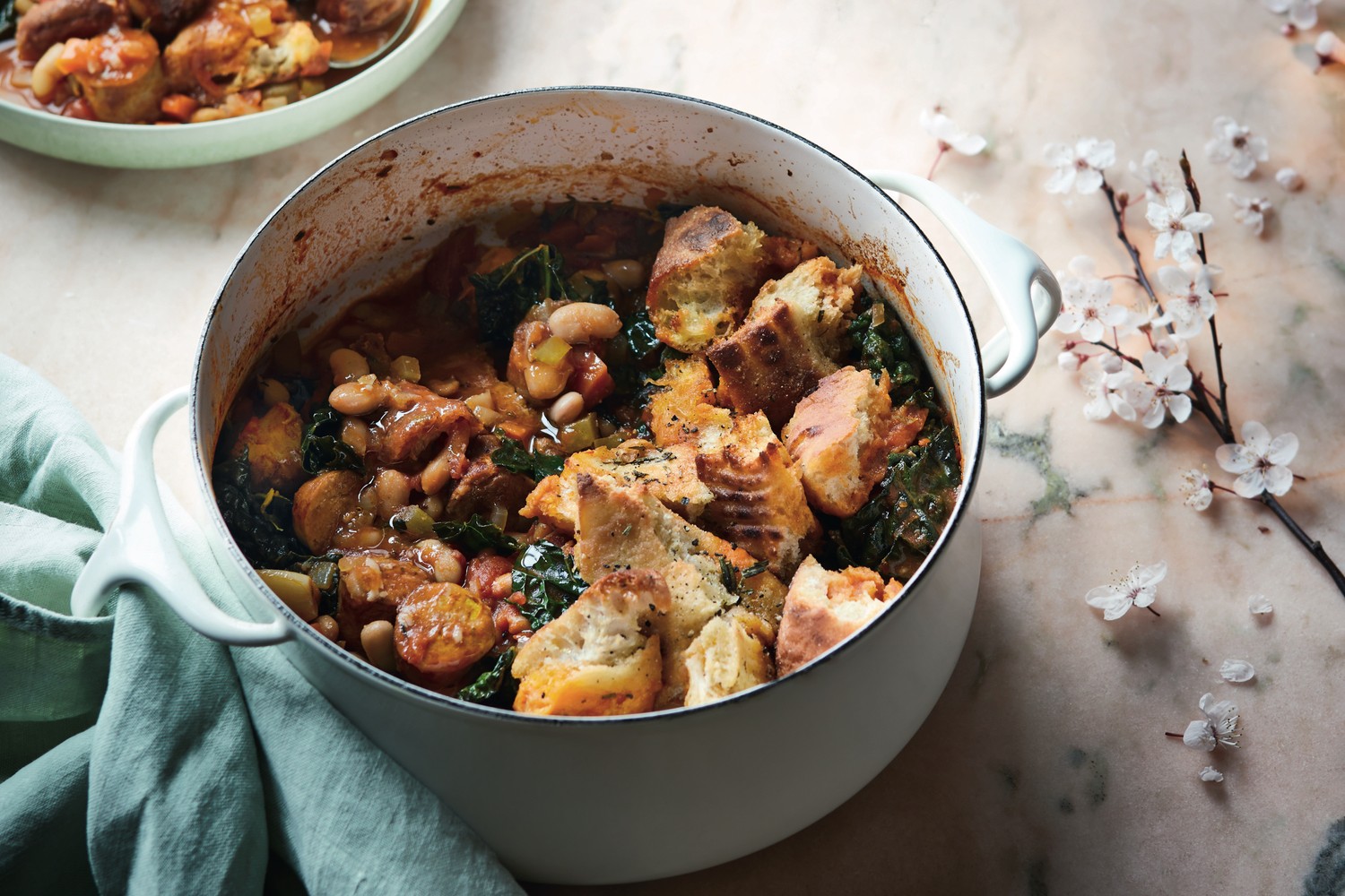 Sausage and bean stew with crunchy focaccia topping