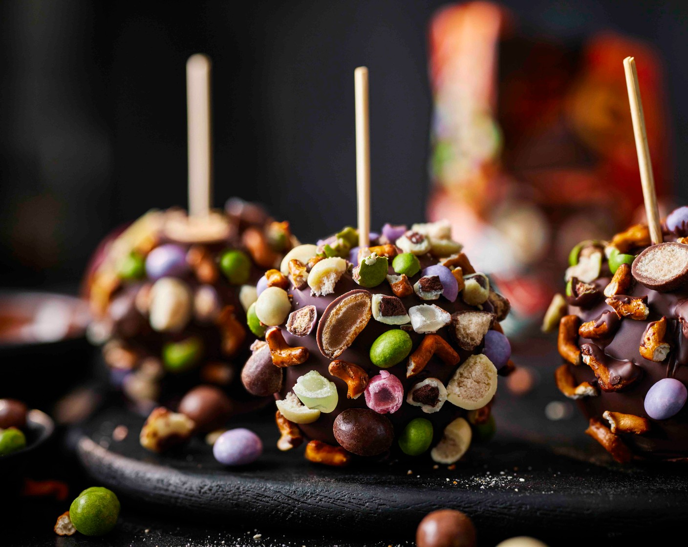 step 7 Place the chocolate-covered pretzels onto the skewers of the apples. Place the apples back on the tray and leave to set in the fridge for 1 hour.