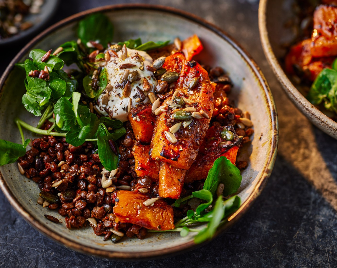 step 4 Arrange the lentils in two shallow bowls and add a spoonful of feta dip (2 tbsp) to each. Top with the squash, lemony watercress and toasted seeds.