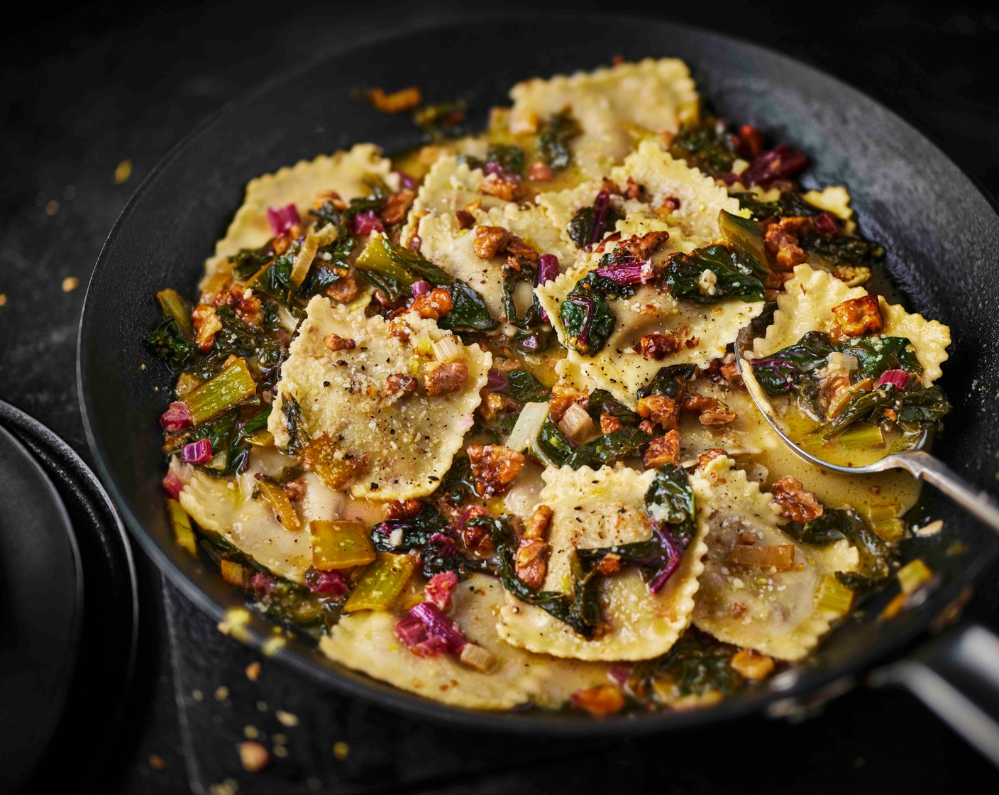 step 5 Add the drained ravioli to the pan and toss gently to coat. Stir through half of the toasted walnuts and most of the Parmigiano Reggiano (50 g) and toss until you have a glossy sauce. Top with the remaining walnuts and Parmigiano Reggiano.