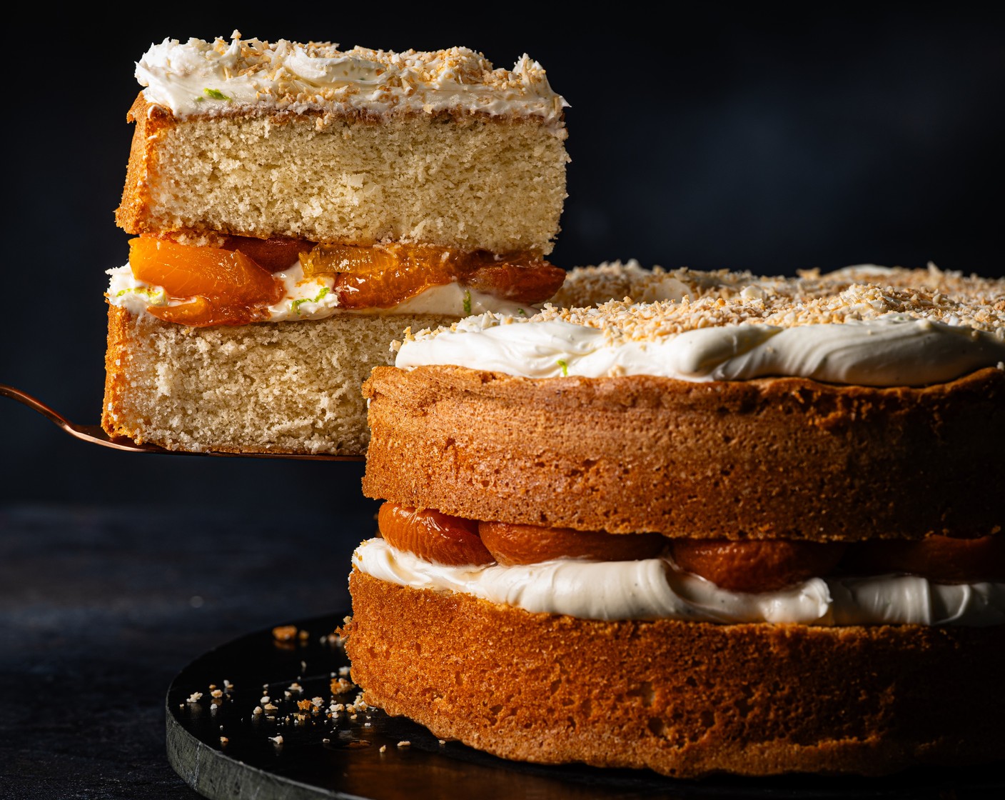 step 6 Add a layer of coconut buttercream to one sponge cake, and top with the apricots. Pop the other cake on top and finish with more coconut buttercream and the toasted coconut.