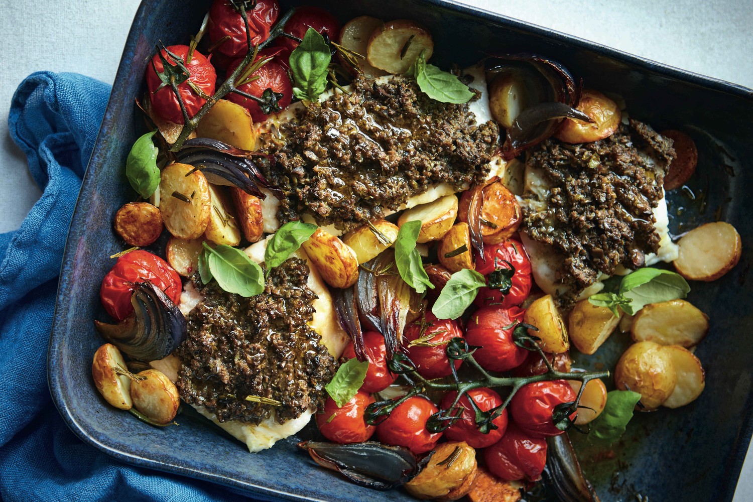 Haddock with olive tapenade and roasted tomatoes