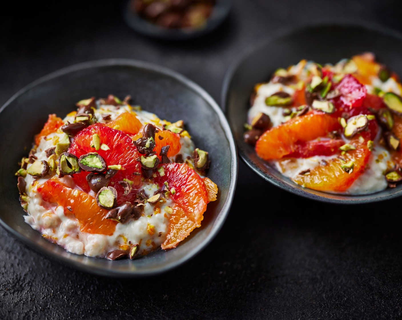 step 3 To serve, top with the orange slices and scatter over the chocolate pistachios (100 g).