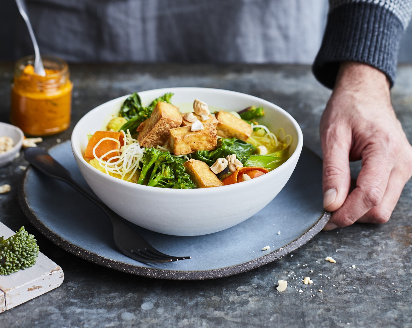 step 5 Divide the noodles between four serving bowls. Pour over the curried coconut broth with veg. Scatter over the crispy fried tofu and a few cashew nuts (as needed), if using.