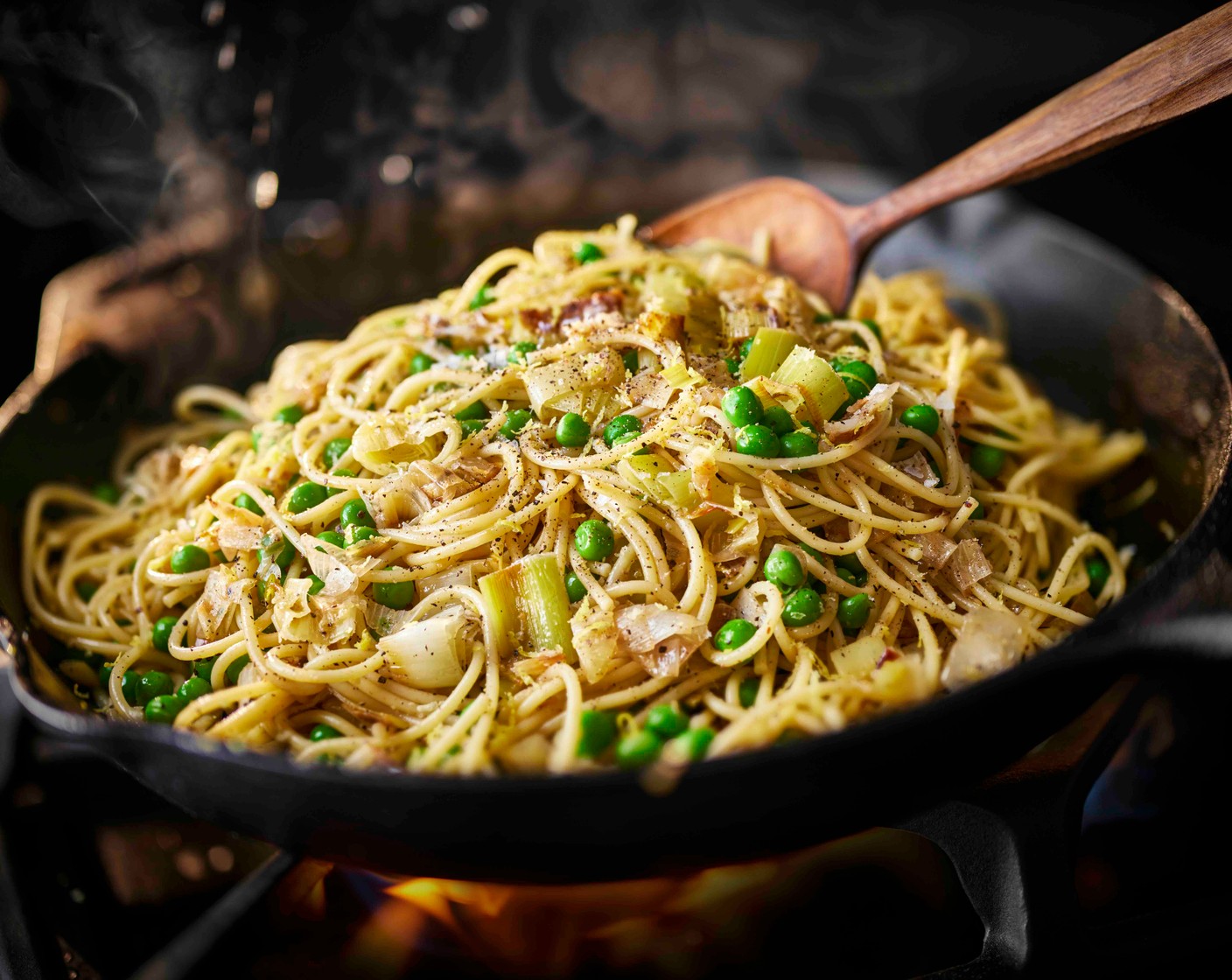 step 3 When the pasta is almost ready, stir the peas (250 g) and lemon zest (1) into the leeks. Toss the cooked pasta into the leeks, along with a little of the pasta cooking water.