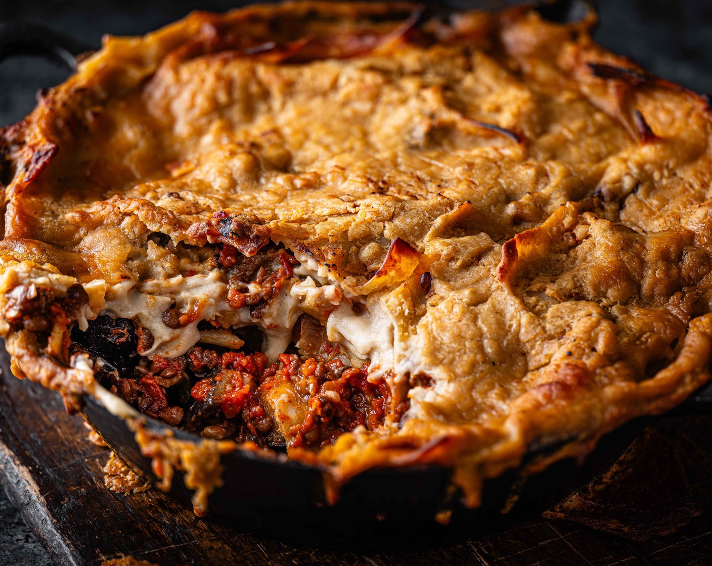 step 6 Pour the bean sauce on top of the pasta mix. Transfer to the oven and bake for 20 minutes, until golden brown and bubbling.
