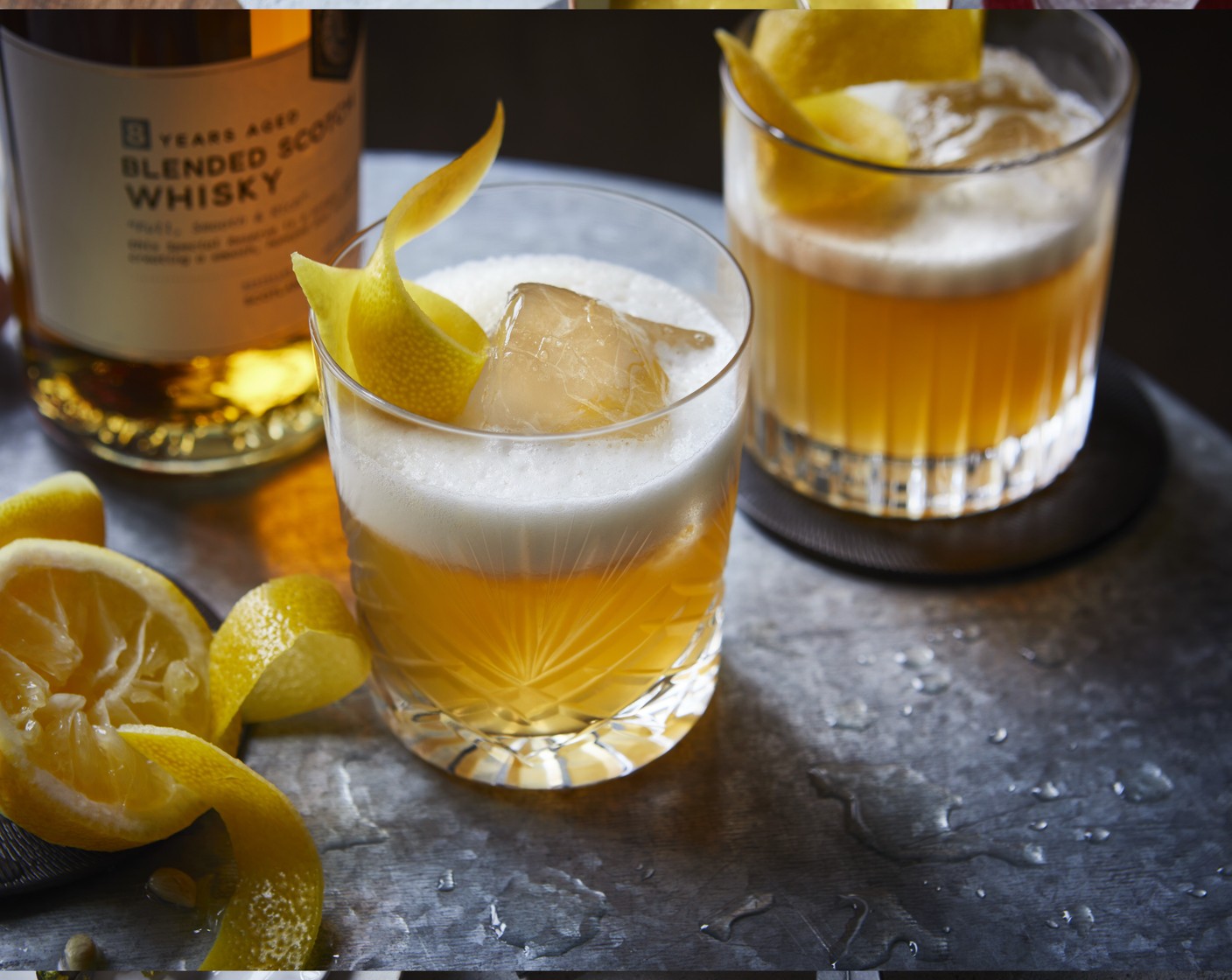 step 2 Shake vigorously and strain into a short glass or tumbler filled with ice and top with a M&S Remarksable Value lemon (1) peel to garnish.