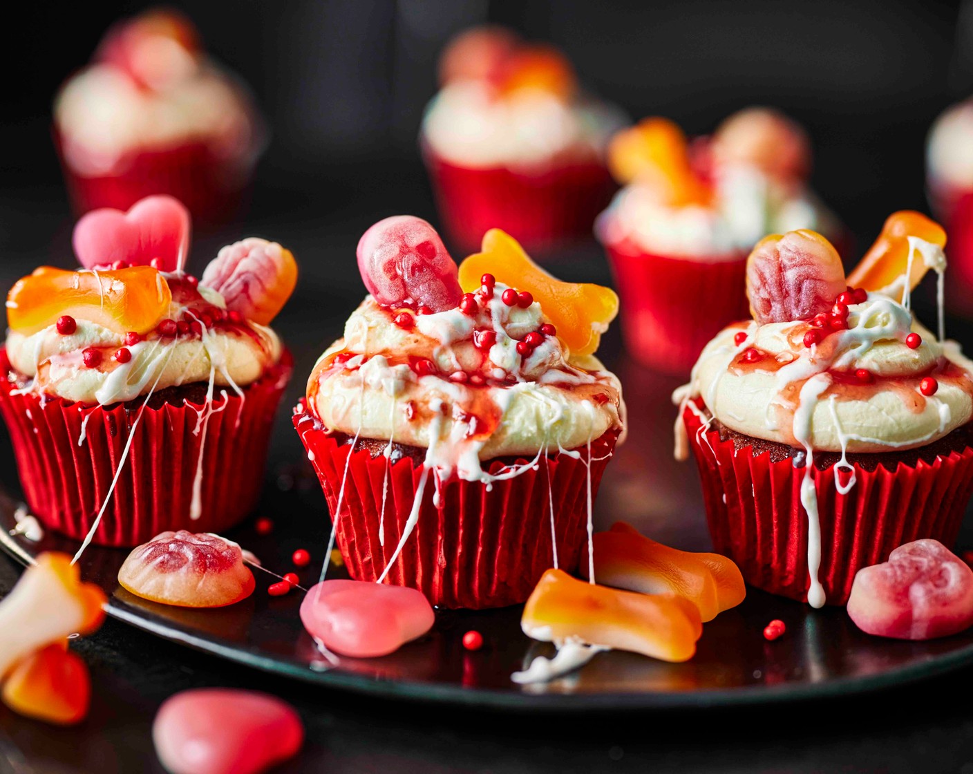 step 9 Top each cupcake with the sweets (1 pack) and a few of the red sprinkles from the cake mix box.
