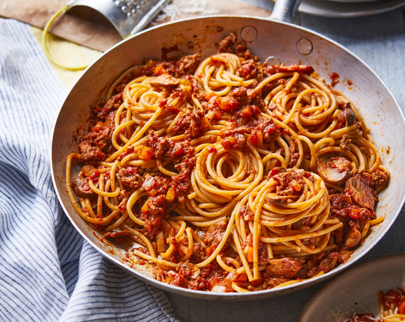 step 4 Meanwhile, cook the pasta (300 g) according to the pack instructions. Divide between 4 serving dishes and serve with the bolognese sauce and the cheese (40 g) on top.