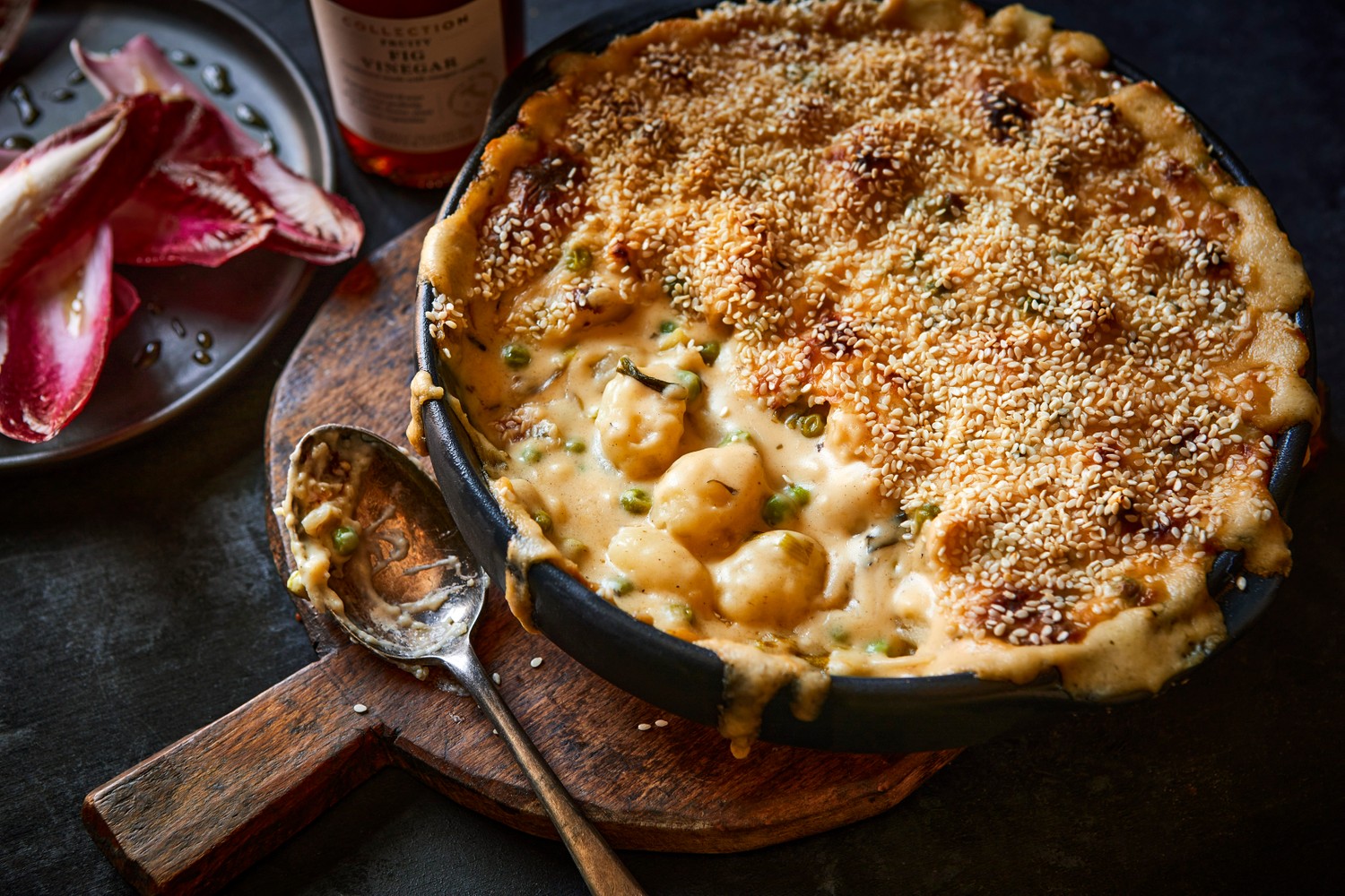 Cheesy Marmite and spring onion gnocchi bake with bitter leaves