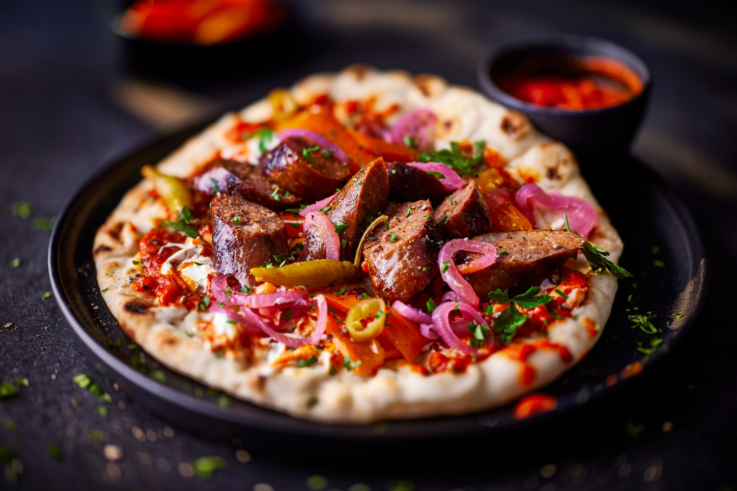 Wagyu beef sausages and ajvar flatbreads