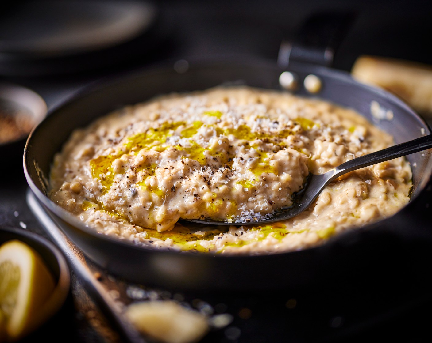 step 6 Serve in bowls, drizzled with a little olive oil, an extra crack of black pepper and lemon wedges (1).