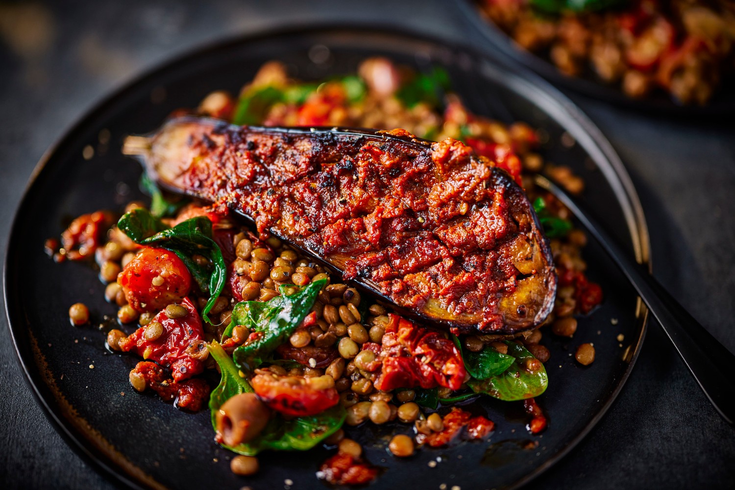 Vegan ‘nduja-roasted aubergines with a warm tomato and lentil salad