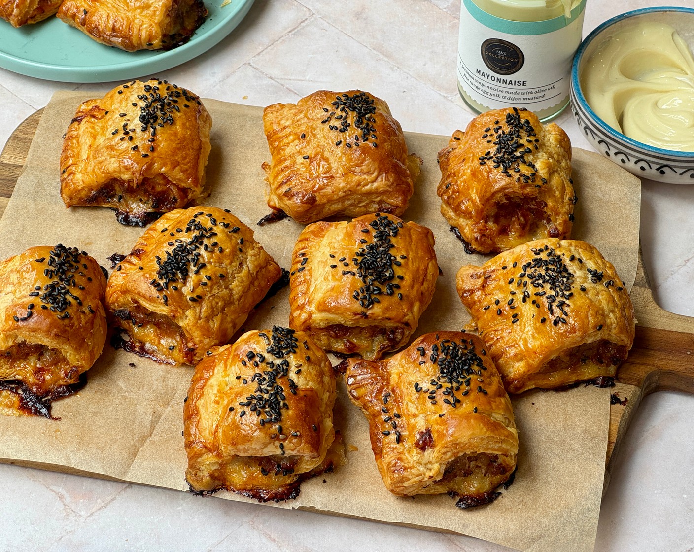 step 4 Cut the two long sausage rolls into 6 smaller pieces, so you have 12 in total. Place them onto your baking sheet and brush the tops with egg (1). Scatter over some nigella seeds (4 tsp) and place into the oven for 25-30 minutes or until golden and crispy. Remove from the oven and let them cool slightly before serving.