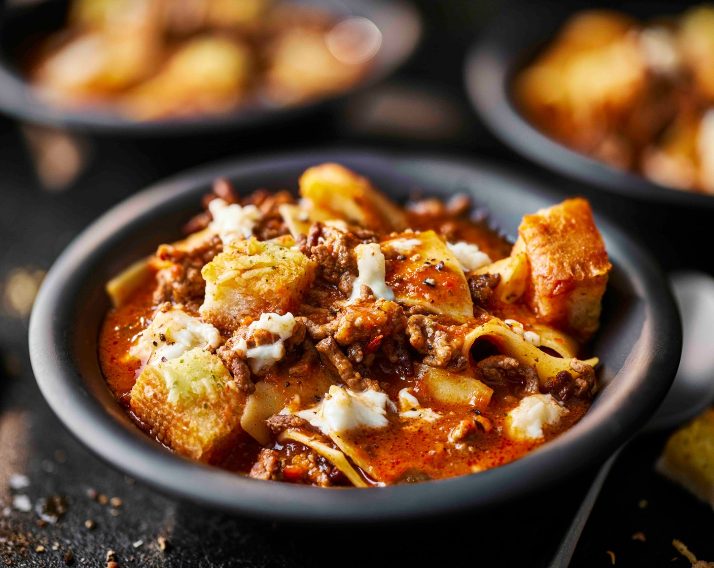 step 6 Ladle the soup into bowls and scatter over the mozzarella (1 pack), allowing it to melt slightly into the hot soup, followed by the croutons.