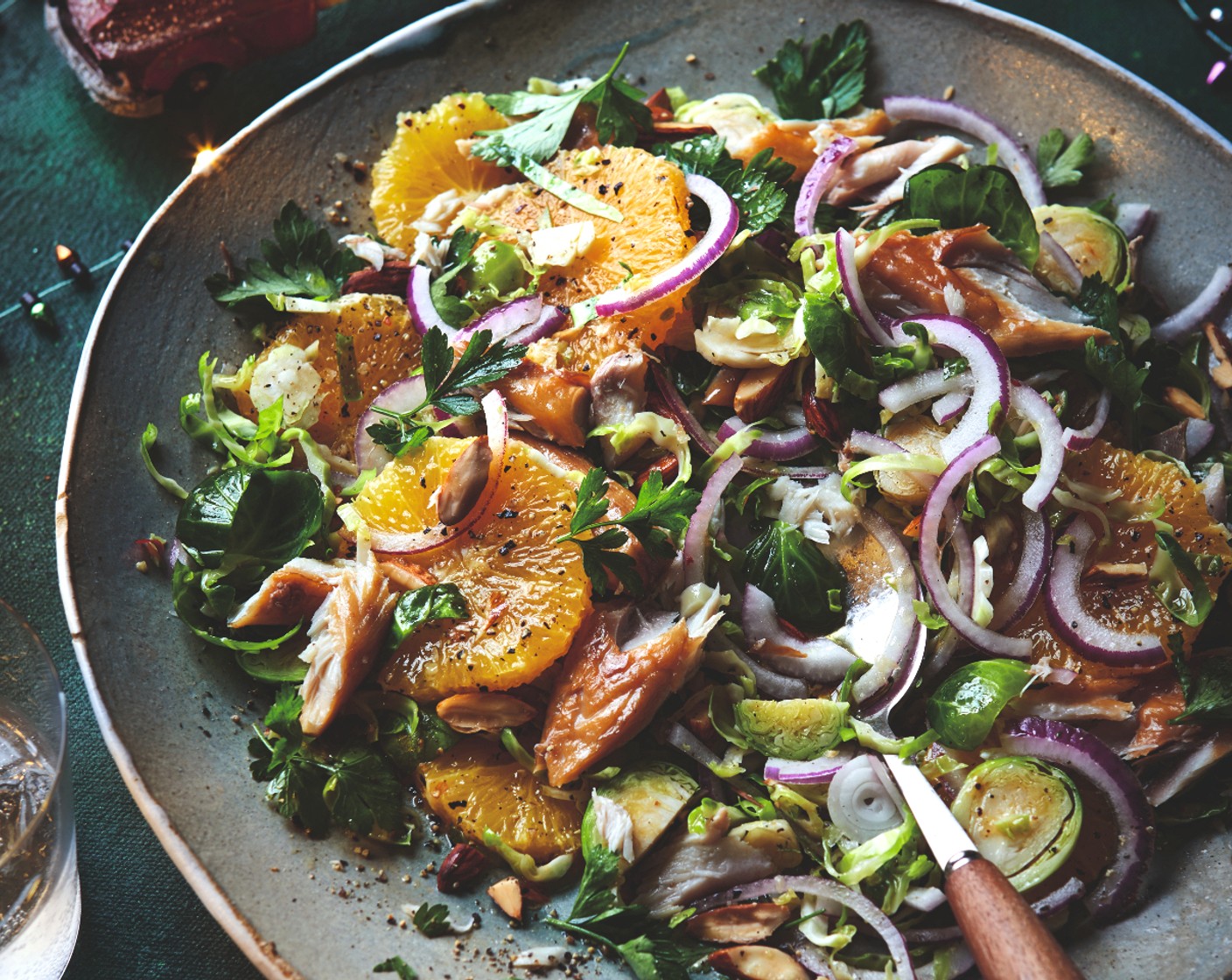 step 3 Gently toss the orange, almonds (40 g), onion and parsley (25 g) into the sprouts (500 g). Flake the mackerel (2) over the top and serve.