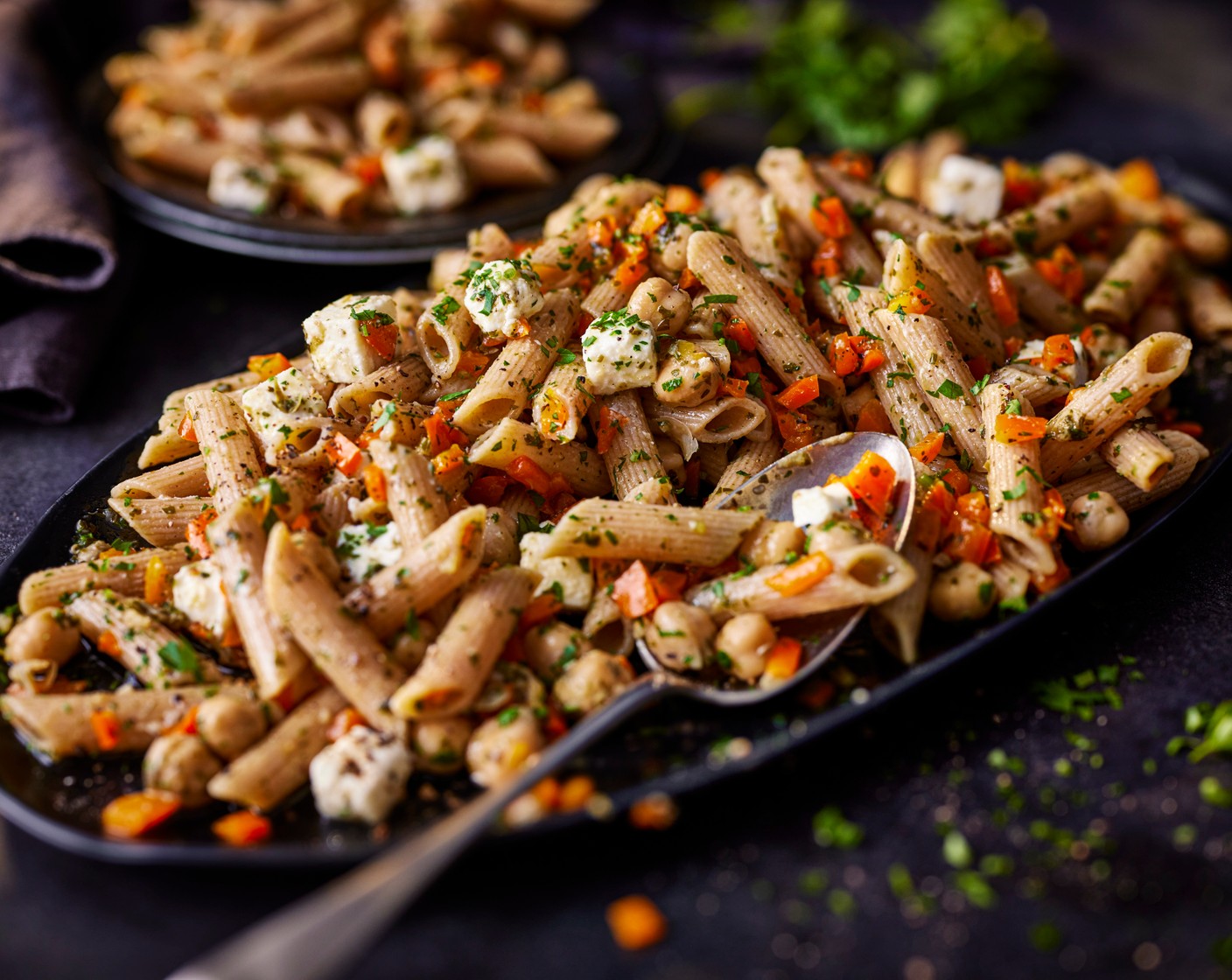step 3 Drain the pasta, reserving a cup of pasta cooking water. Stir the pasta into the peppers, feta and chickpeas in the bowl, adding a splash of cooking water if needed to create a glossy sauce, and serve.