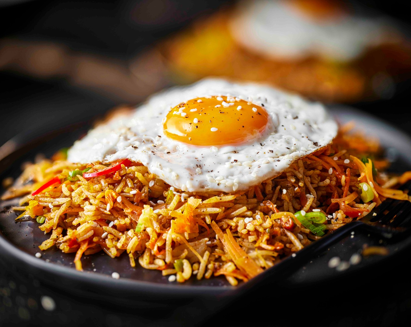 step 4 Serve the rice in bowls topped with the crispy fried eggs.