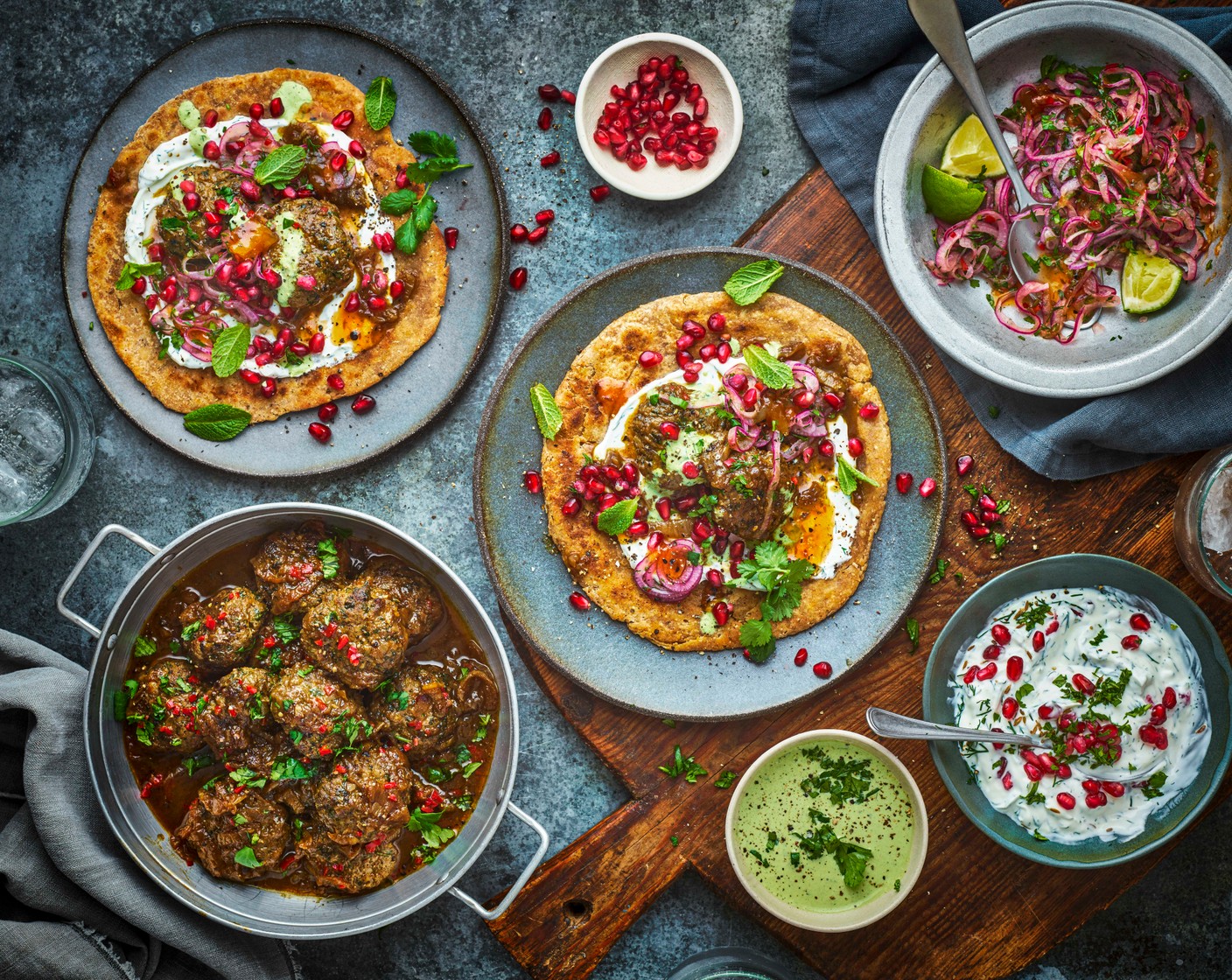 step 11 To serve, sprinkle the russa with the coriander (1/2 pack). Serve the sauce with the lamb vrura, parathas, pomegranate raita and spicy onions.
