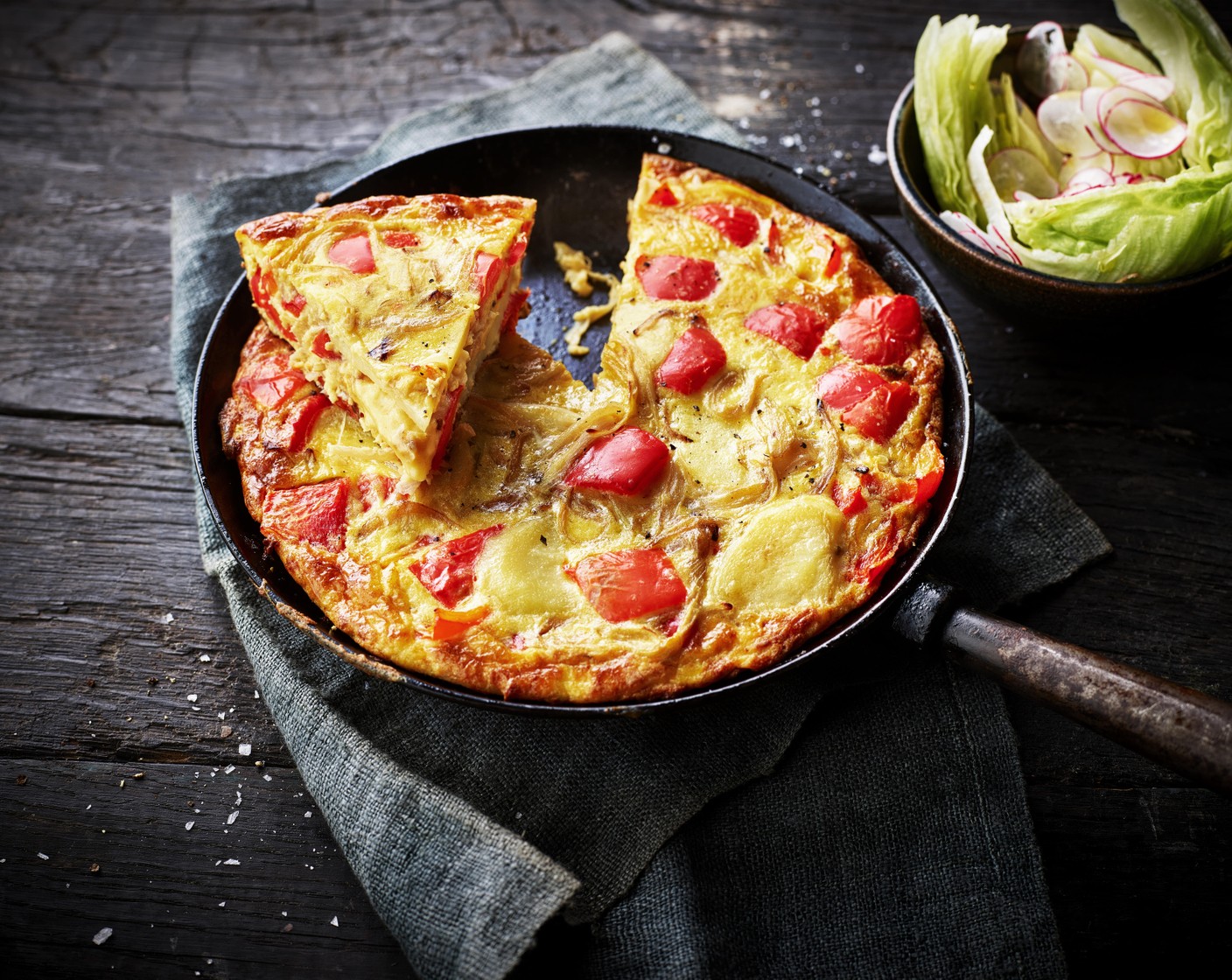 step 5 Toss the lettuce (1/2) with a little olive oil and white wine vinegar (as needed), and serve alongside the frittata.