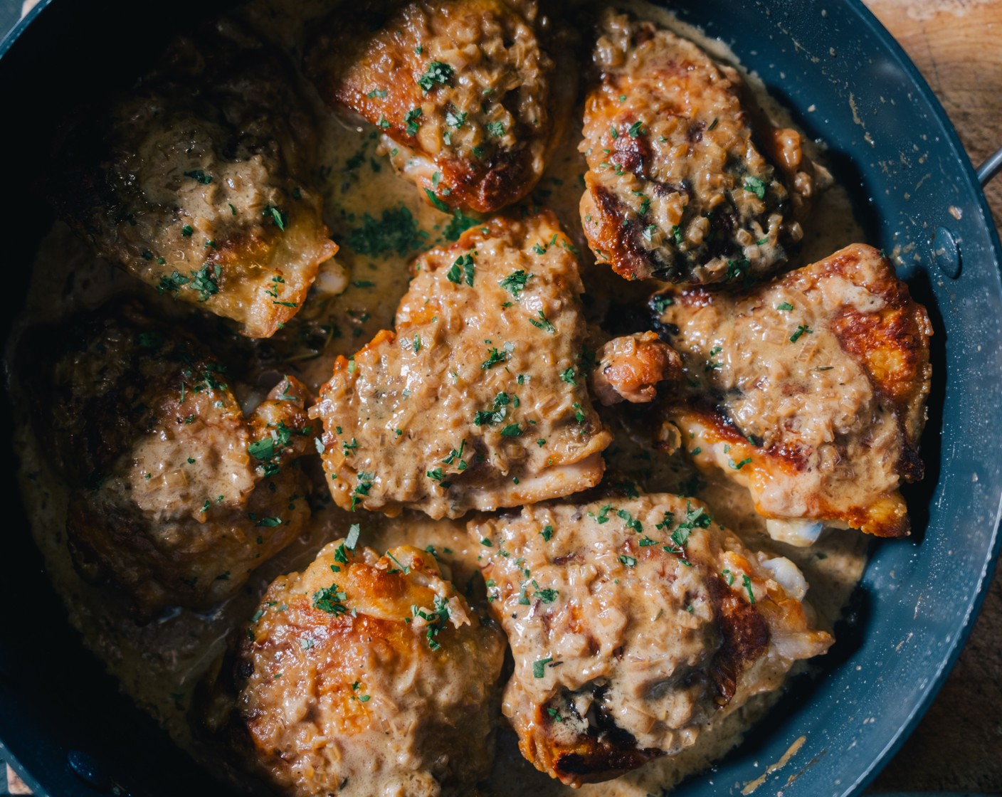step 6 Let this sauce simmer for around 2-3 minutes or until it has thickened. Season to taste. Remove the chicken thighs from the oven and add them back to the pan. Serve the sherry chicken into shallow bowls and serve with mashed potato (1 tub). Scatter over the chopped parsley (1/2 bag).