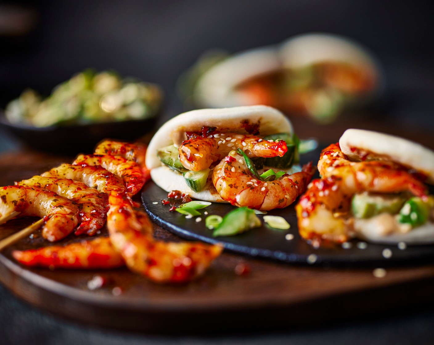 step 5 Serve the prawns and cucumber salad in the bao buns with an extra sprinkling of sesame seeds and some of the juices from the prawns.