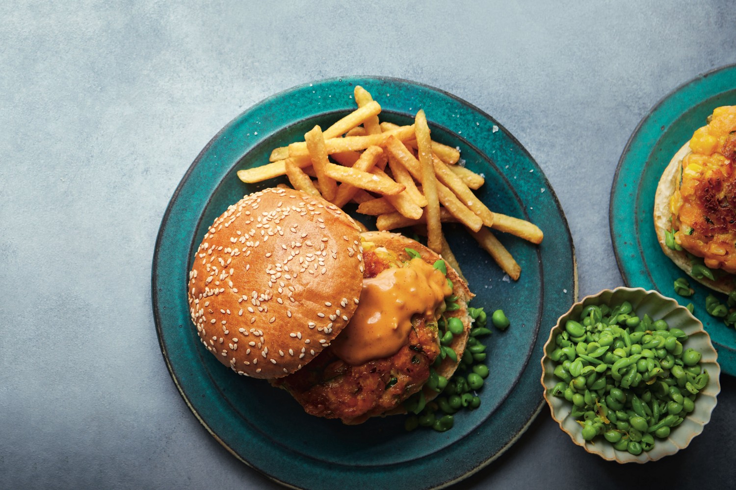 Fritter burgers with pea smash and vegan burger sauce