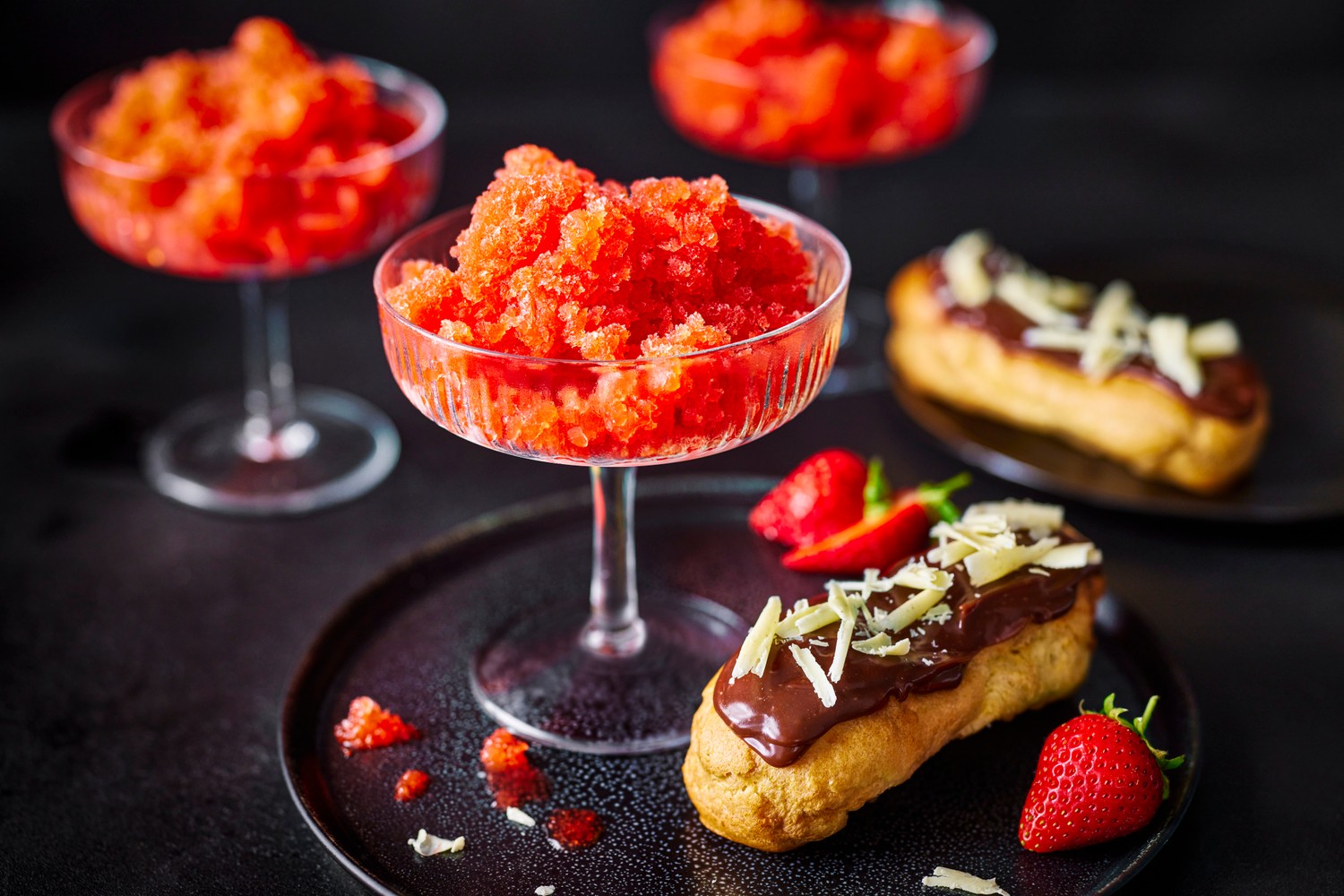 Chocolate éclairs with strawberry and champagne granita