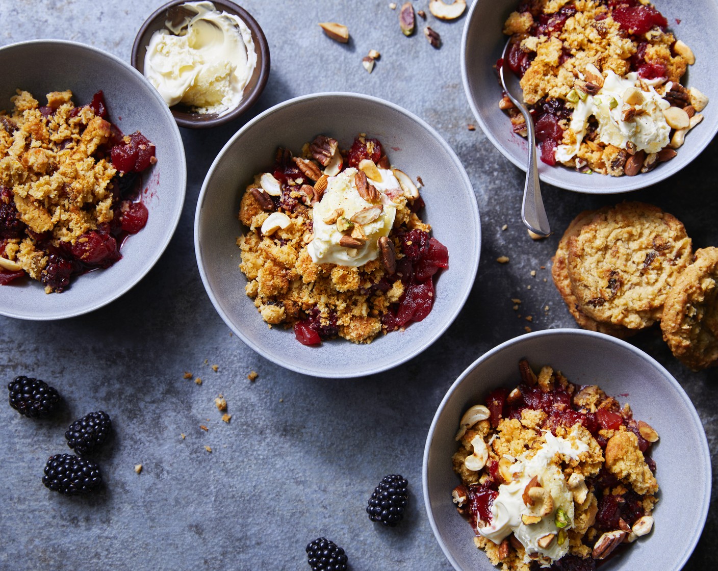 step 3 Divide the mixture between 4 bowls, crumble an cookie (4) over each and serve with a dollop of clotted cream (1 pot) and some mixed nuts (1 handful), if you like.