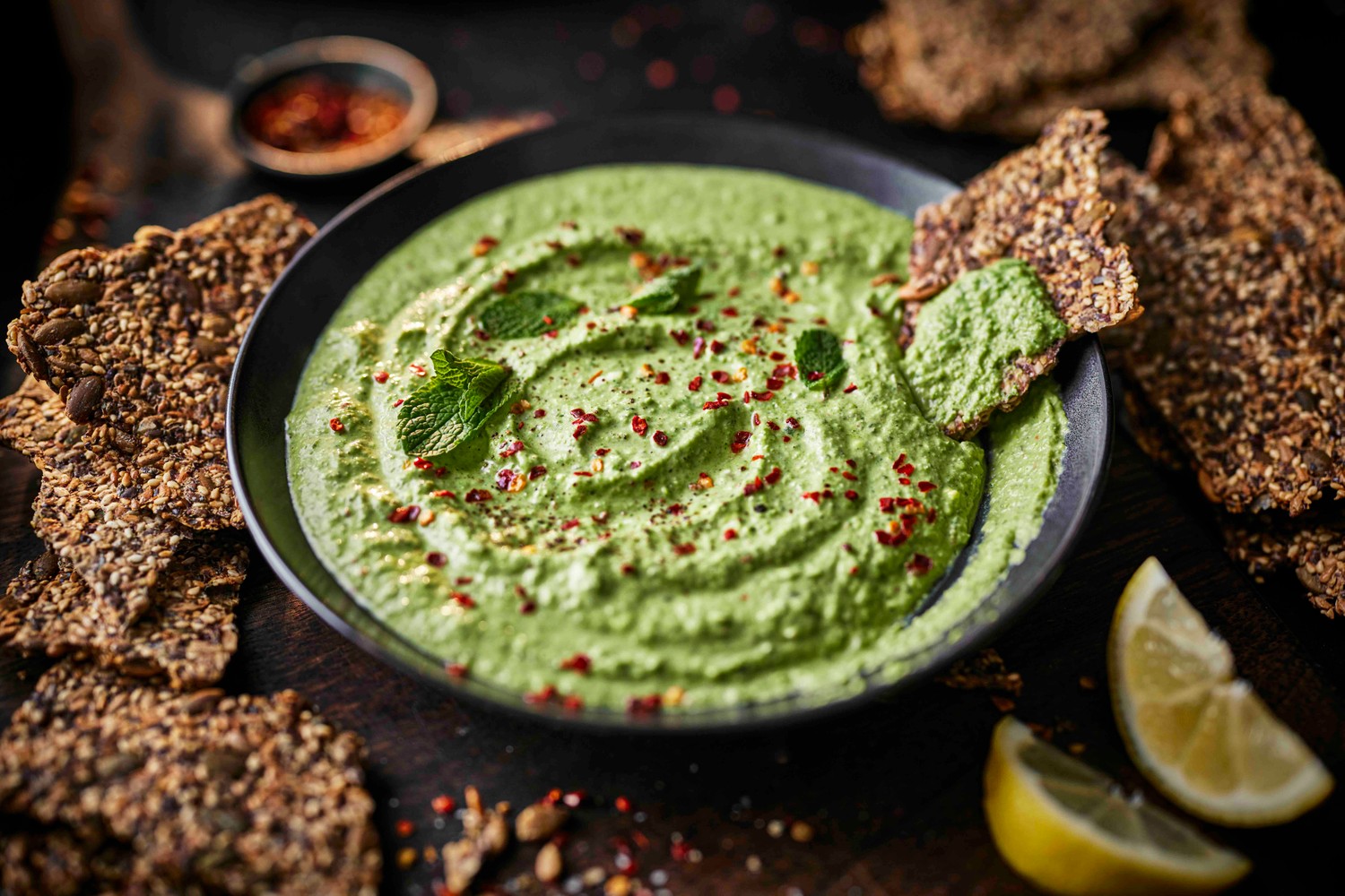 Seedy crackers with a pea and feta dip
