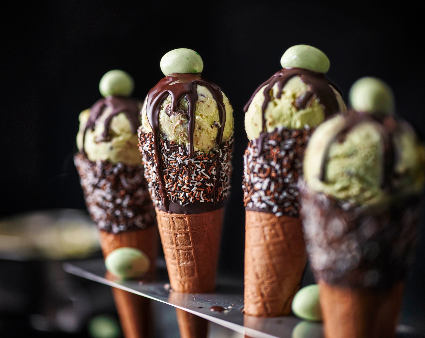 step 7 Serve the ice cream in the cones (12) with an extra drizzle of chocolate sauce and topped with another speckled egg (12), if you like.