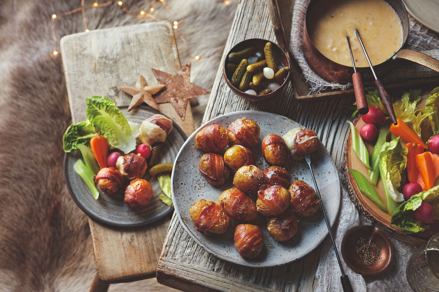 Truffle cheddar fondue with potatoes in blankets and cornichons