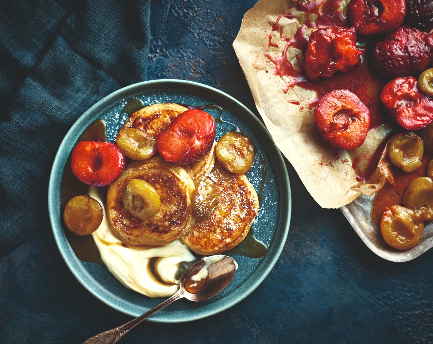 Ricotta hotcakes with honey butter-roasted greengages and plums