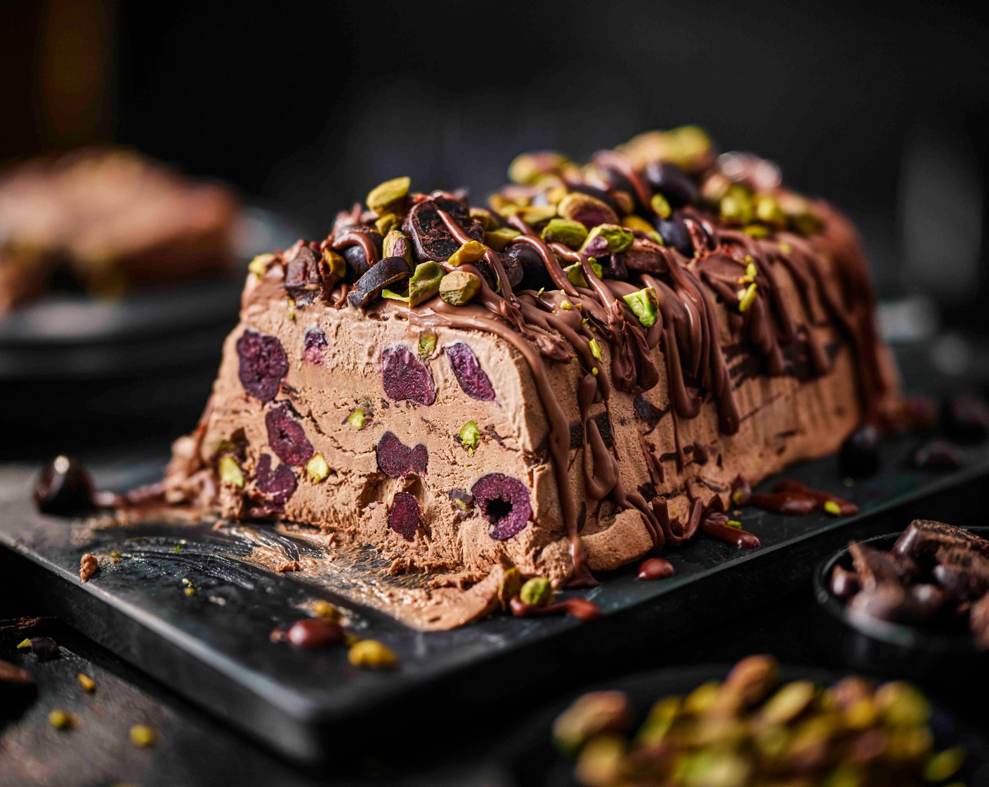 step 15 Dip a knife in hot water and slice the semifreddo. Serve with the remaining chocolate sauce alongside.