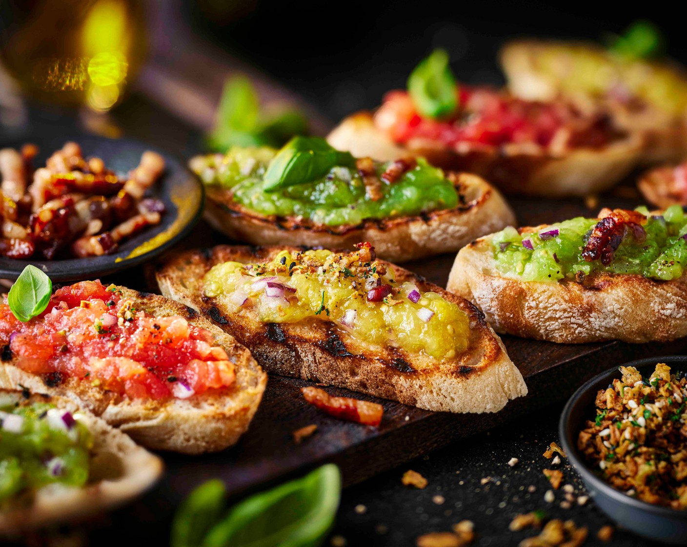 step 6 Scatter the cooked suino nero over the toasts. Sprinkle with the top that seasoning (1 tbsp) and garnish with basil leaves (1 handful).