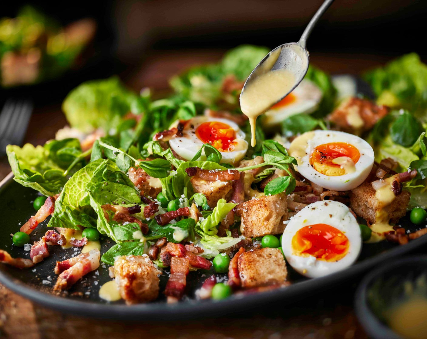 step 8 Tuck the egg halves into the salad, season lightly and finish with an extra drizzle of dressing just before serving.