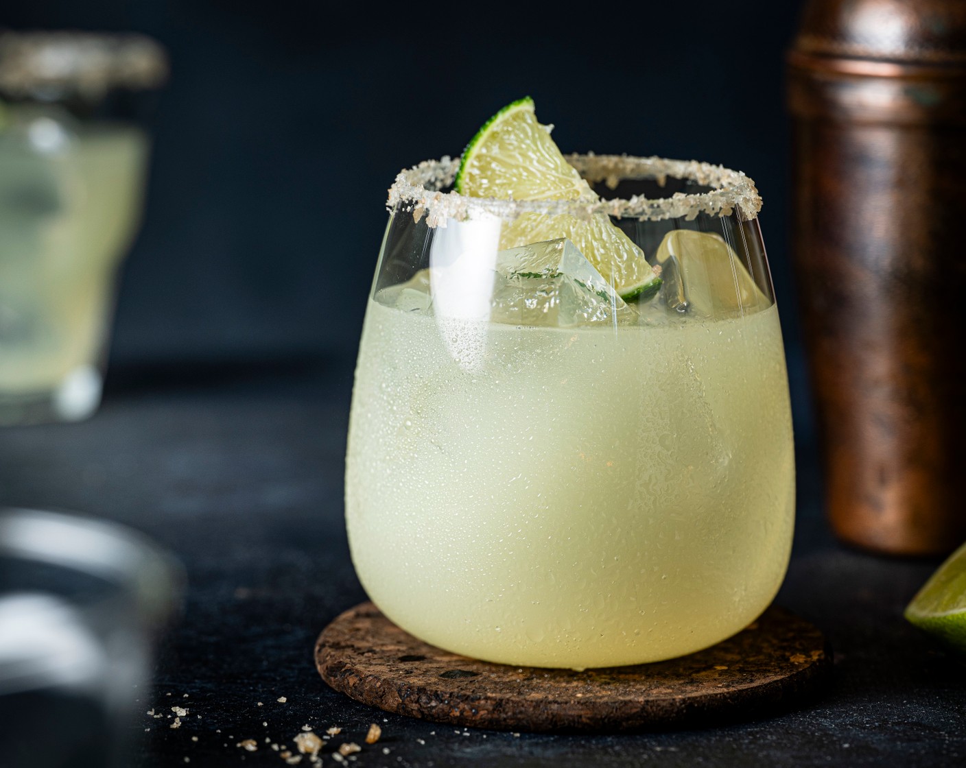 step 3 Fill a tumbler with ice and strain the cocktail mixture into the glass. Serve with a lime wedge (1 wedge).
