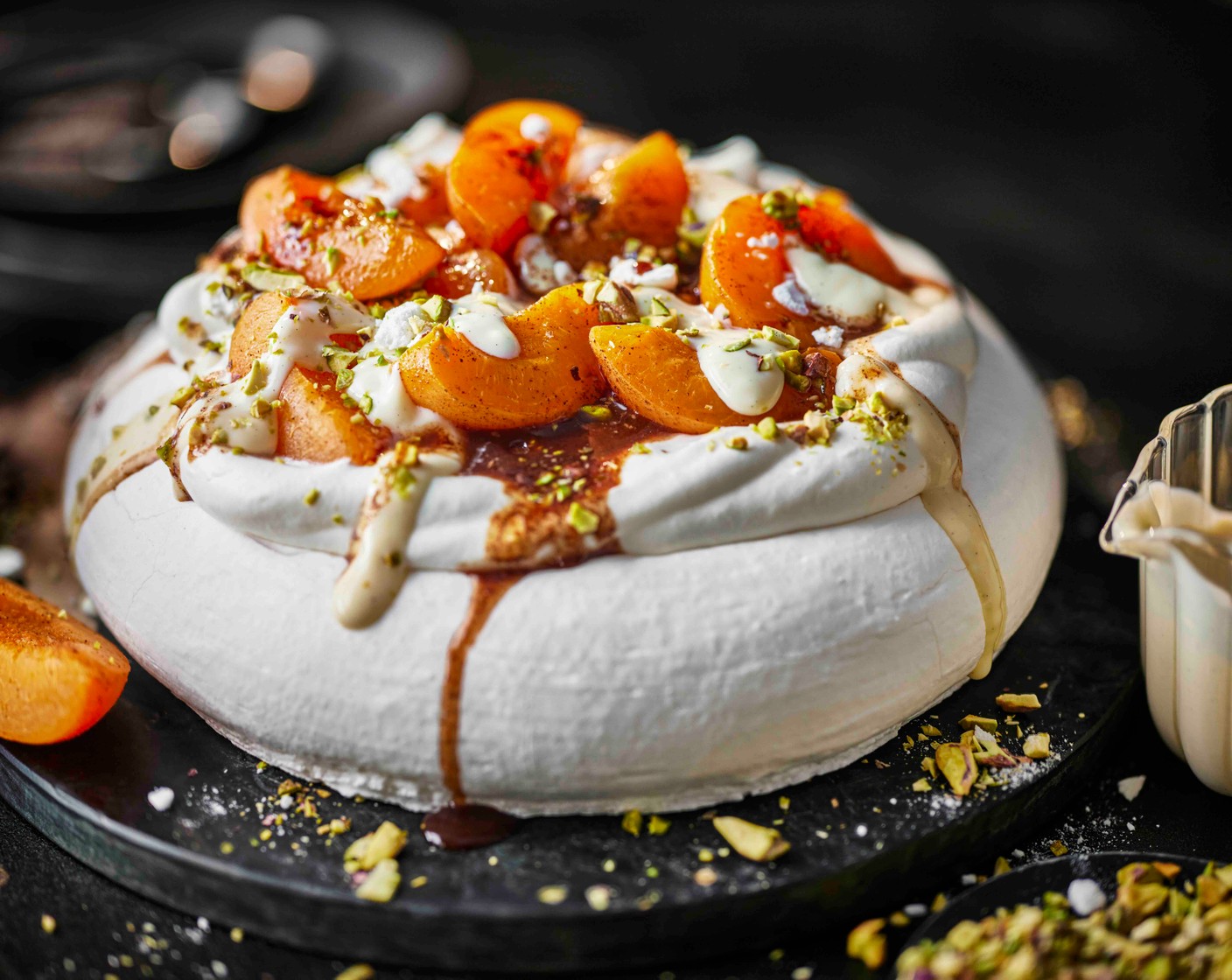 step 5 Spoon the apricots on top of the cream, then scatter over the pistachios (1 handful), crumbled meringues (as needed) and a drizzle of the amaretto syrup. Serve straight away.