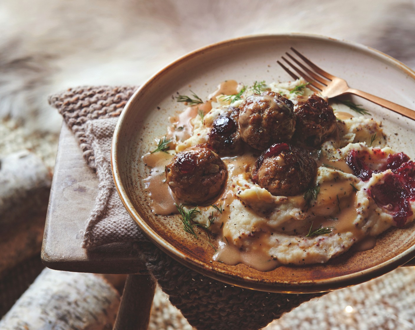 step 7 Divide the mash between serving dishes and top with the meatballs and sauce. Garnish with a dollop of M&S Collection cranberry and port sauce (to taste) and a scattering of dill (1 handful).