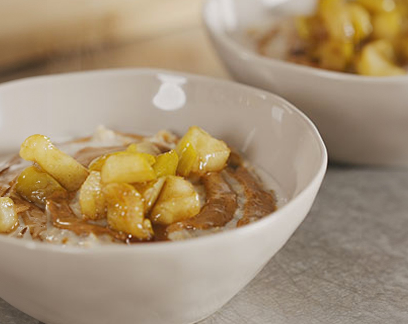 step 4 Divide between serving dishes and finish each with the remaining diced apple and M&S smooth almond butter (2 tbsp).