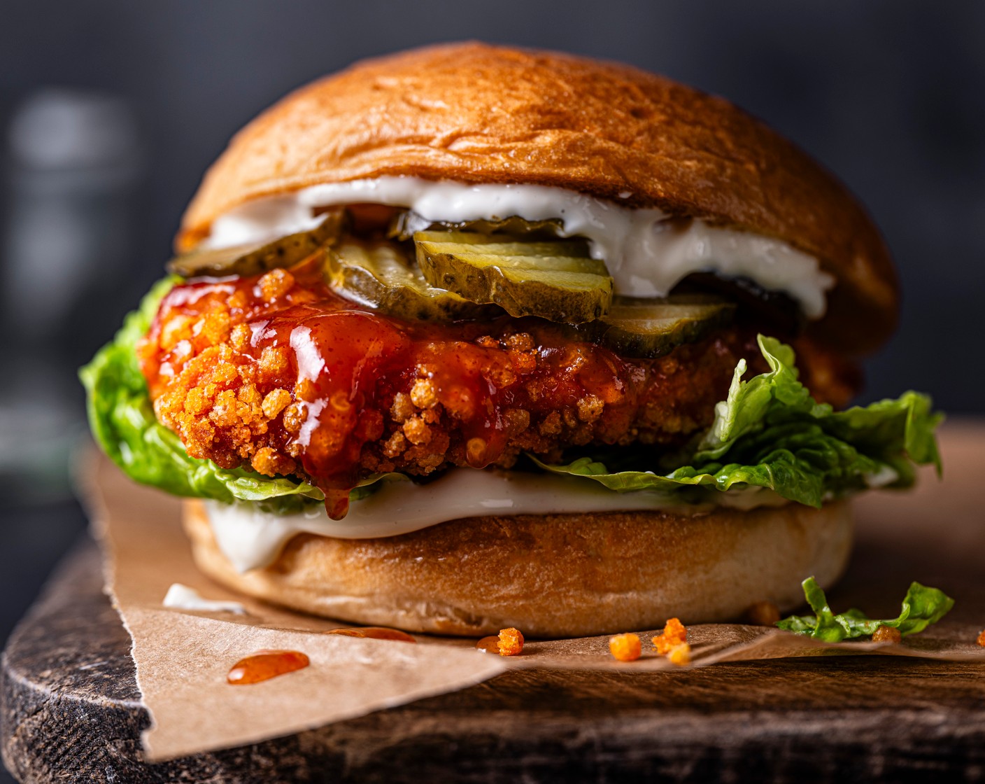 step 2 When you’re ready to serve, lightly toast the brioche buns (4). Spread the roasted garlic mayo (4 tbsp) on each base, top with the hot honey chicken, followed by the pickles (2 tbsp) more garlic mayo and lettuce (as needed).