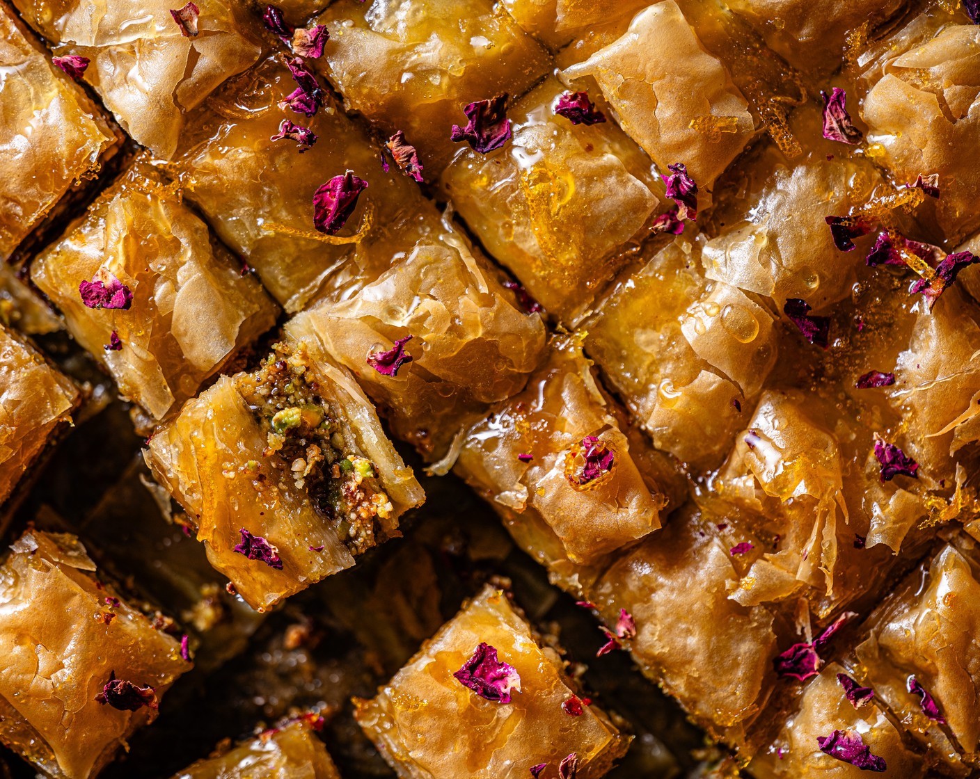 step 7 Pour the warm syrup over the baklava and allow to cool completely before serving. To garnish, sprinkle over the dried rose petals (1 tsp).