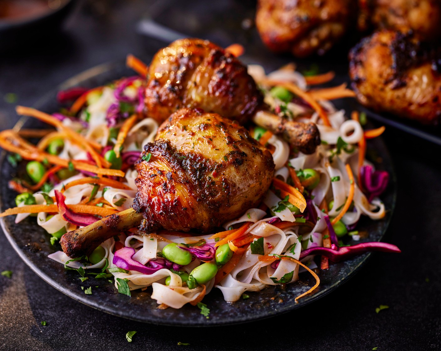 step 5 Serve the chicken lollipops on top of the noodles, with a scattering of roasted peanuts (1 tbsp), if you’d like.