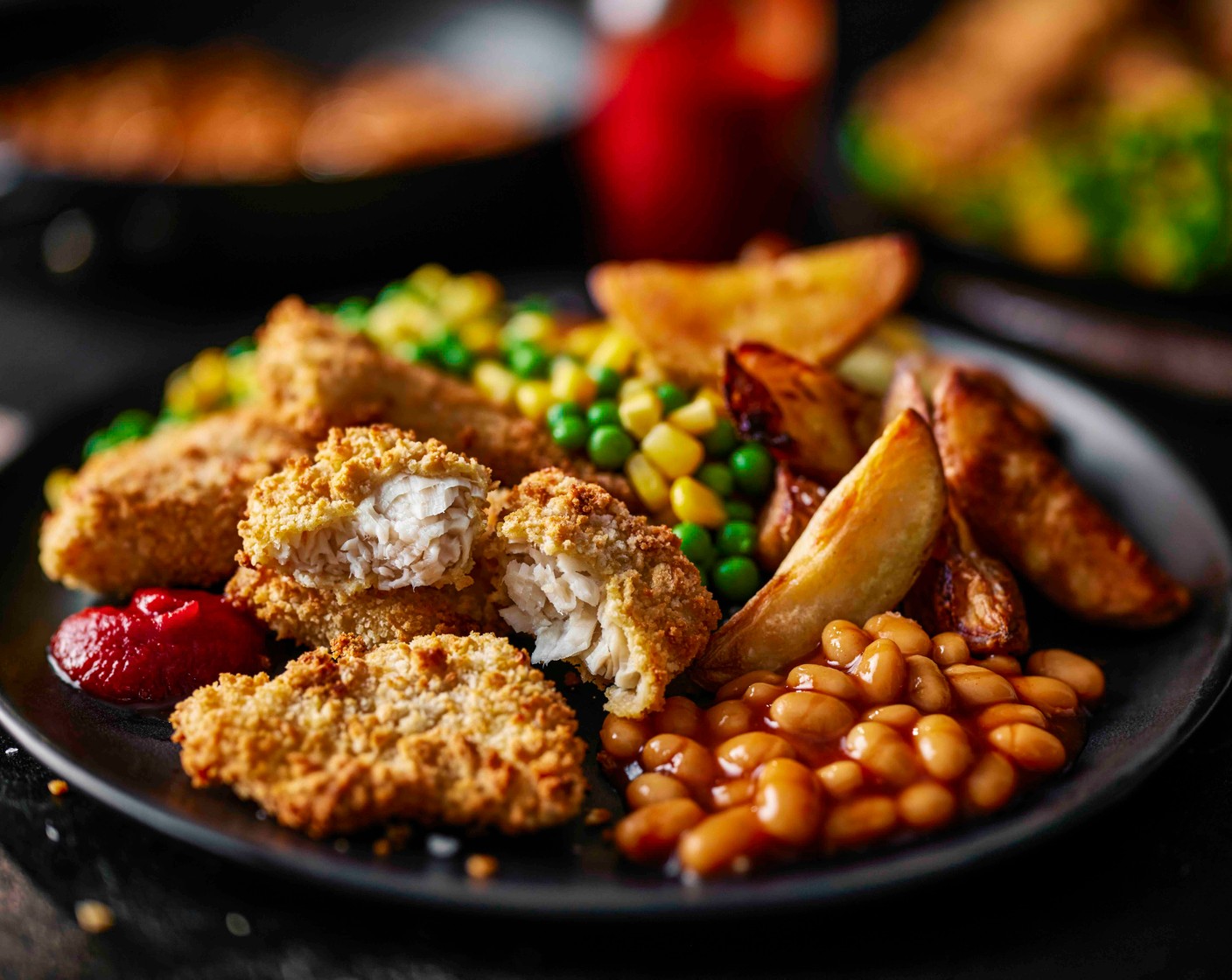 step 5 Serve the fish nuggets with the wedges, peas and beans, with a dollop of ketchup (as needed), if you like.