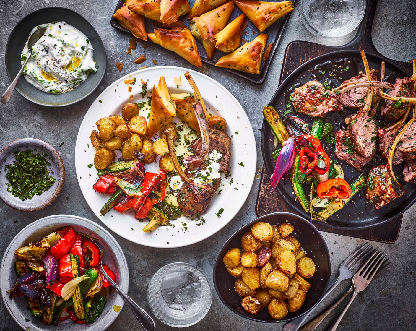 step 13 To serve, place the potatoes and roasted vegetables in serving bowls and season with flaky salt. Serve with the lamb along with the filo parcels and tzatziki.